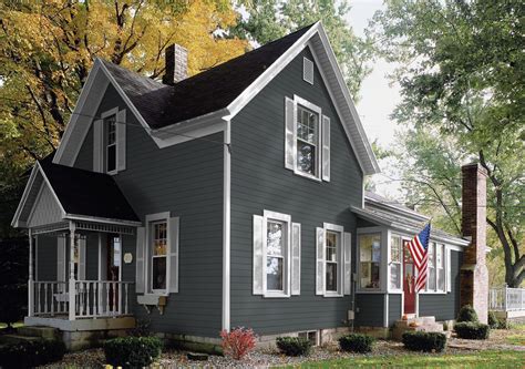 grey house white metal roof|gray house with dark trim.